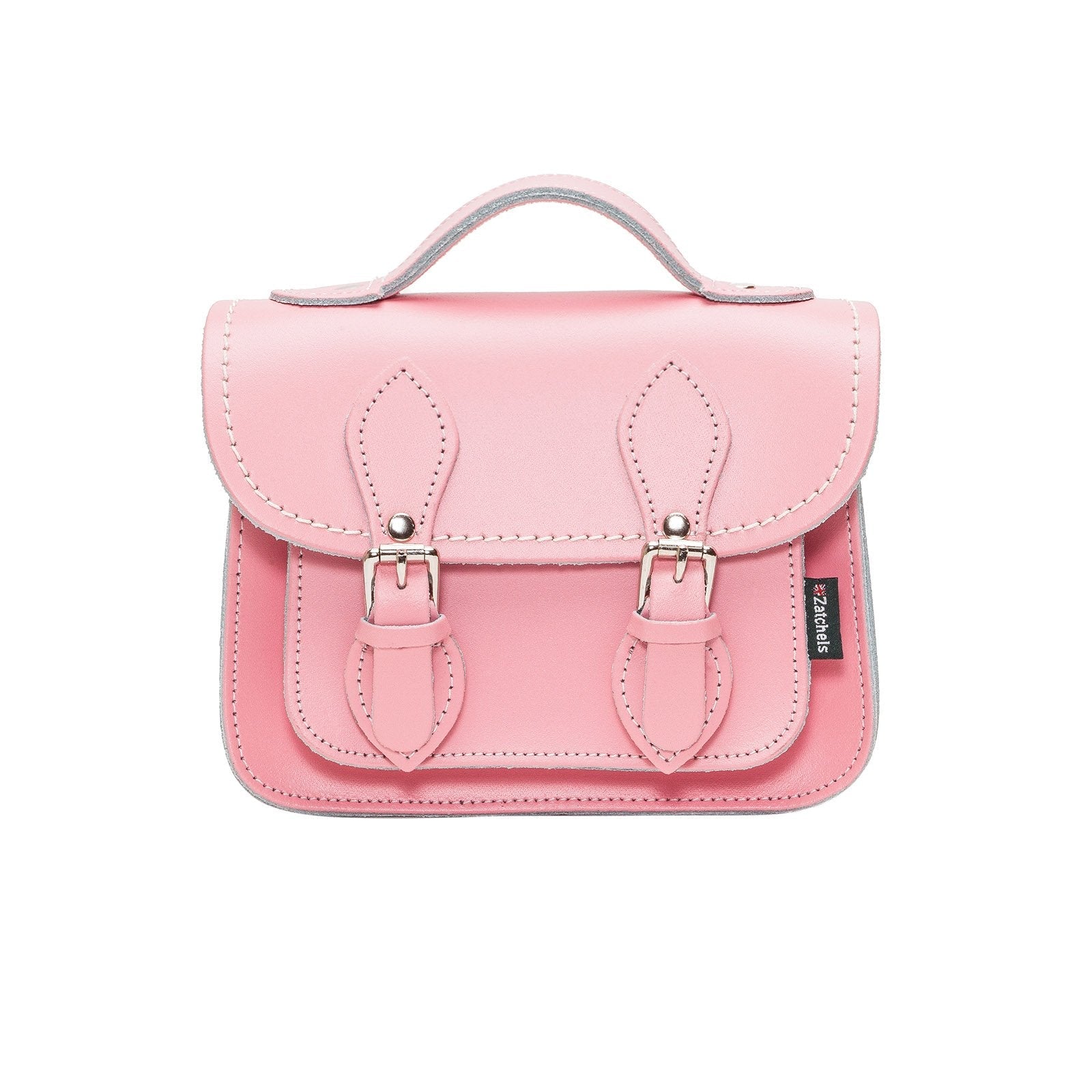 Handcrafted pastel pink leather micro satchel with adjustable strap, showcasing luxurious craftsmanship and elegant design.