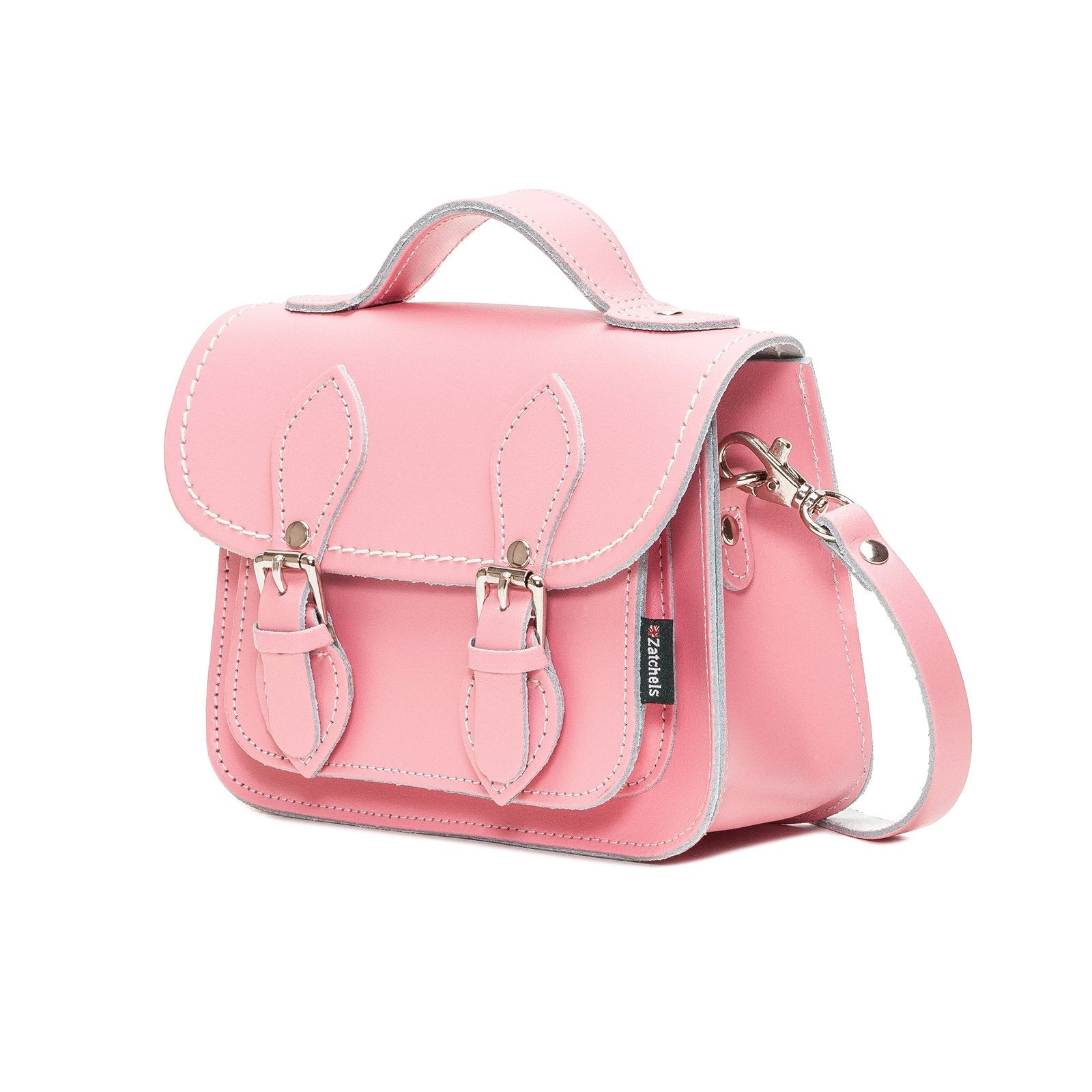 Elegant pastel pink leather micro satchel displayed on a stylish model, demonstrating its versatility for both casual and formal occasions.