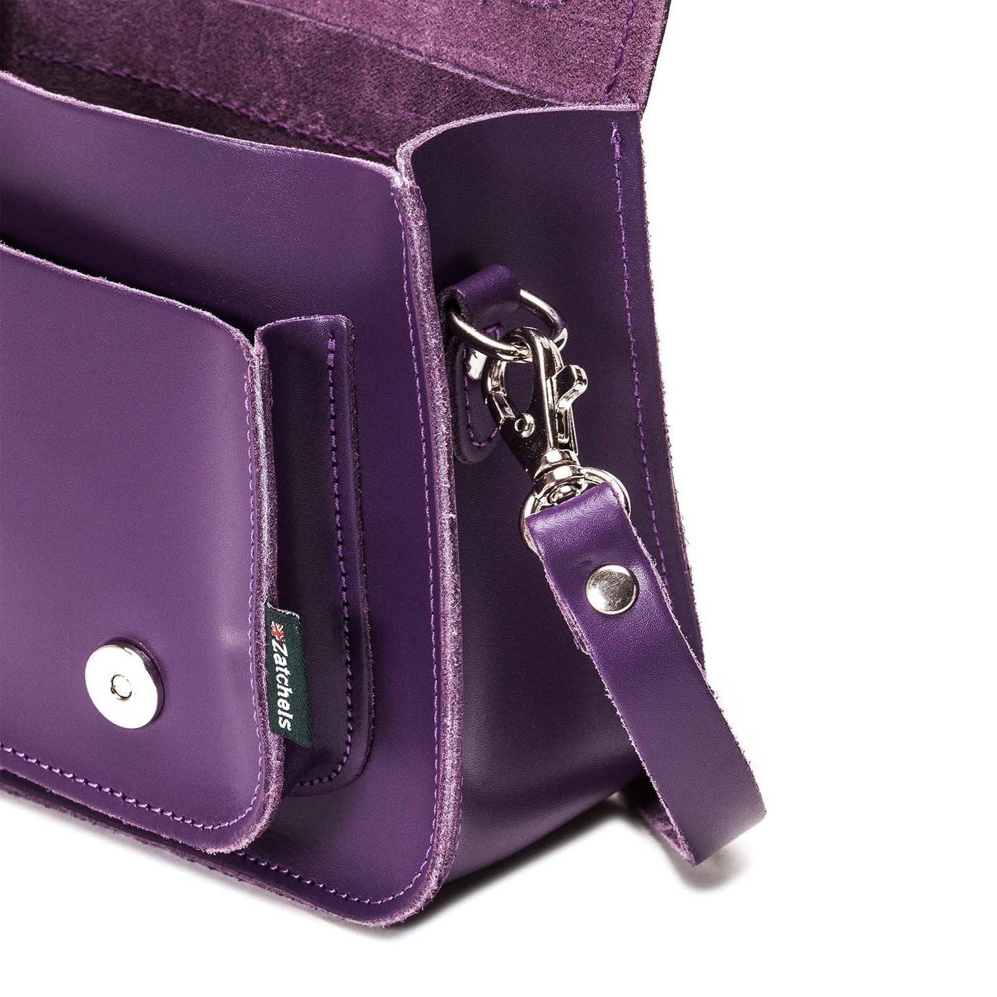 Elegant handmade purple leather micro satchel from Zatchels featuring a chic design, adjustable strap, and premium craftsmanship, perfect for any occasion.