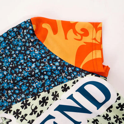 Stylish flat lay of the Sweet Legend Women's Vibrant Print Cropped Tee, designed by Dazzling Dreams Studio, ideal for creating versatile outfits.