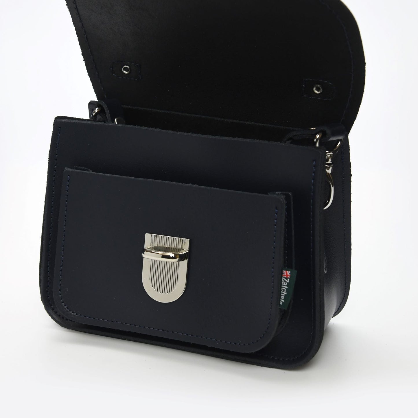Model showcasing the Zatchels Luna bag in navy leather, styled as a cross-body bag, illustrating its versatility and sophisticated appeal.