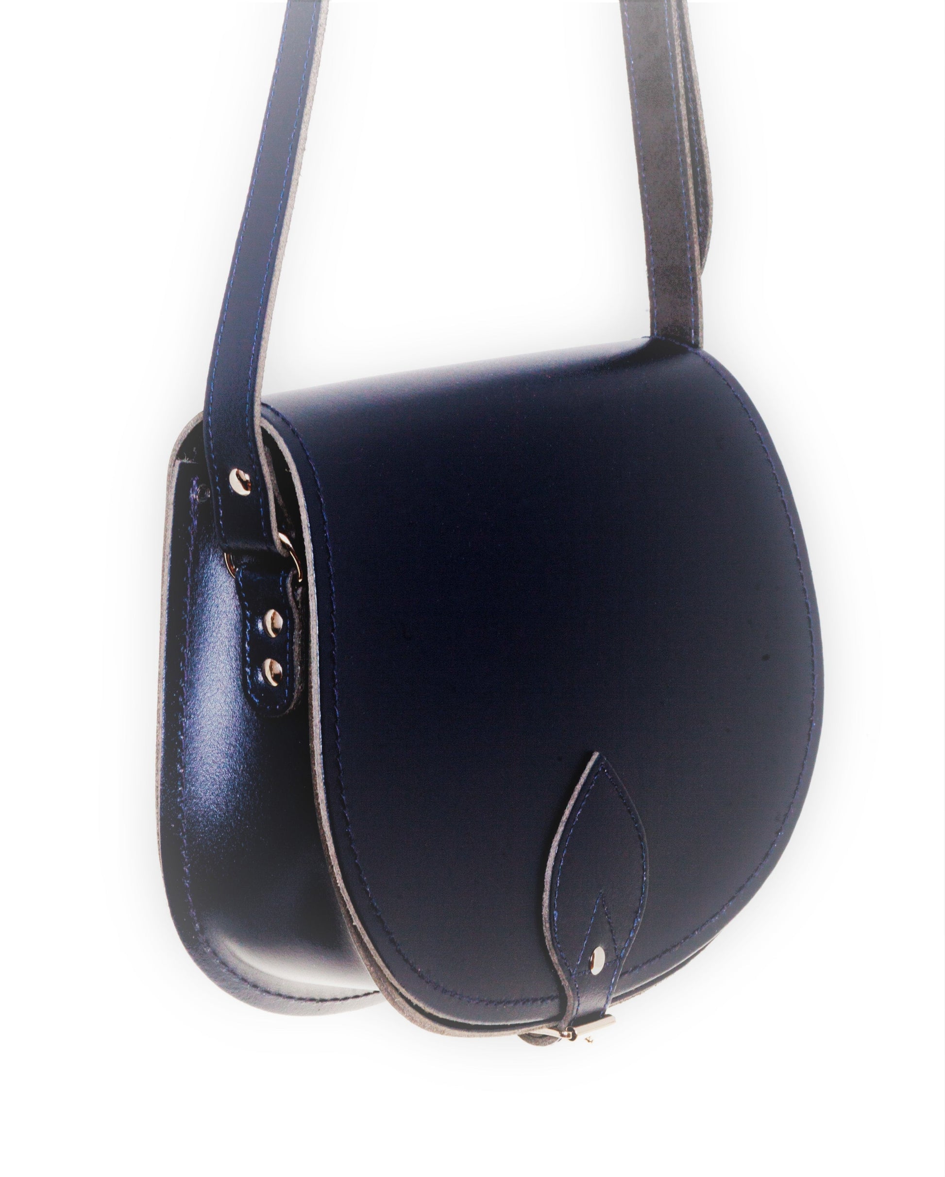 Versatile handmade navy leather saddle bag with an adjustable crossbody strap, perfectly crafted for luxury and functionality.