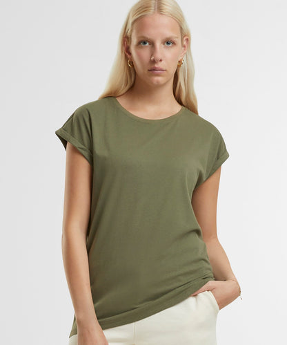 Fashionable women's t-shirt in a stylish setting, highlighting the breathable and soft qualities of organic cotton fabric.