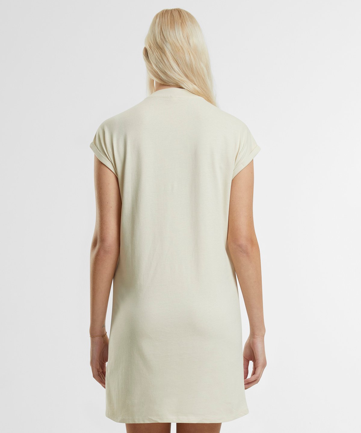 Elegant relaxed fit of the organic cotton t-shirt dress on a model, demonstrating its flattering drape and versatile styling options for any occasion.