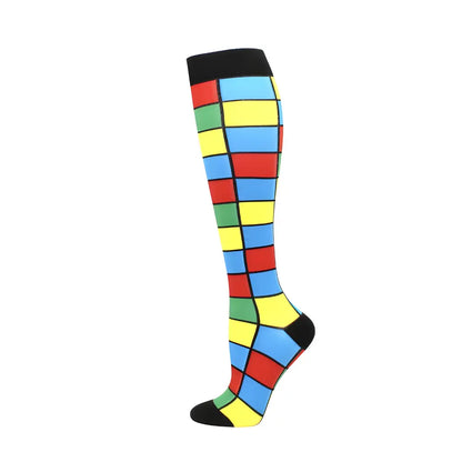 Stylish women's knee length compression travel socks featuring a vibrant Rubik's Cube design for elegance and comfort during travel.
