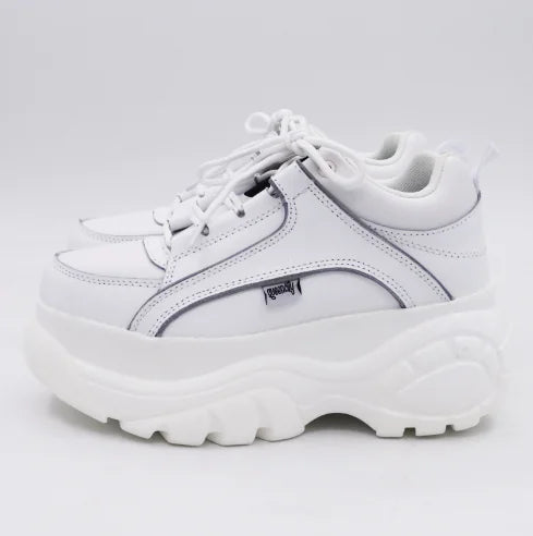 Classy white platform sneaker showcasing an elegant silhouette, perfect for high-fashion ensembles.