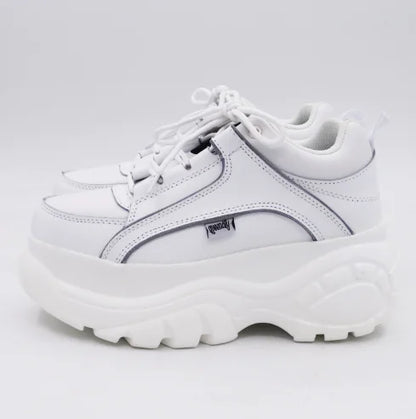 Classy white platform sneaker showcasing an elegant silhouette, perfect for high-fashion ensembles.