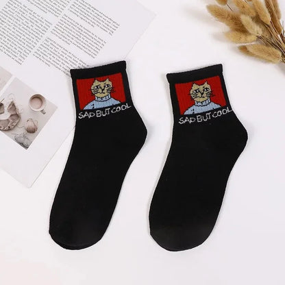 Stylish Hip Hop Long Socks for Women & Girls featuring a playful cartoon design with a 'Sad but Cool' cat motif, made from a comfortable cotton and polyester blend, perfect for adding flair to any outfit.
