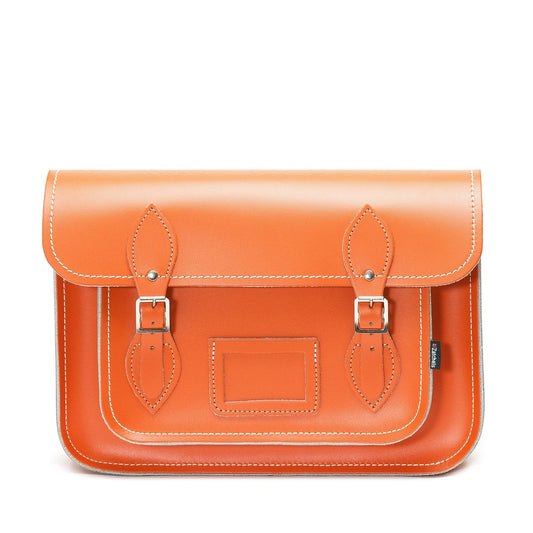 Luxury Handmade Leather Satchel in vibrant orange, showcasing traditional British craftsmanship and contemporary design.