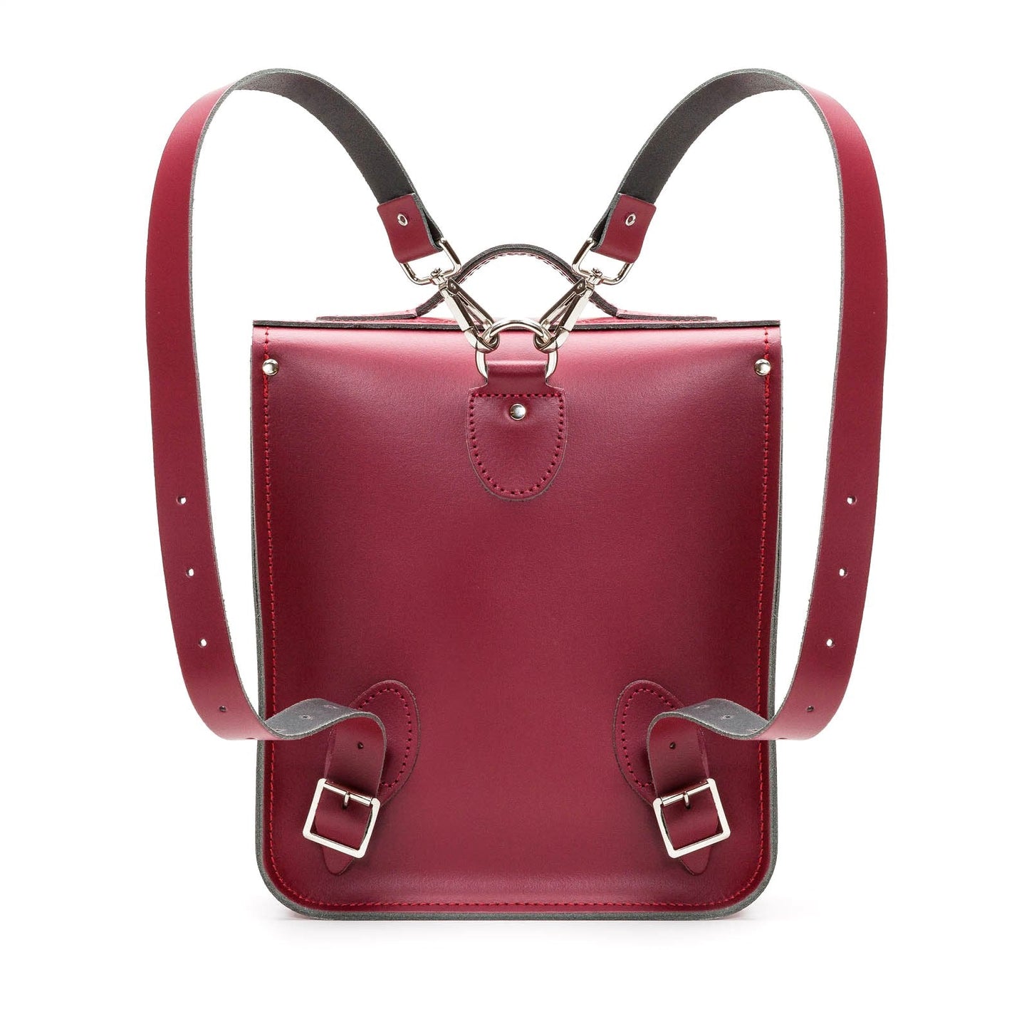 Compact and stylish Oxblood leather backpack resting on a chic urban setting, perfect for modern city explorers.