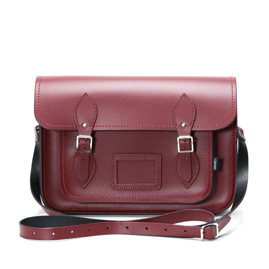Stylish Oxblood Red Leather Satchel, highlighting personalisation options and its versatility to be worn as a shoulder bag or cross-body.
