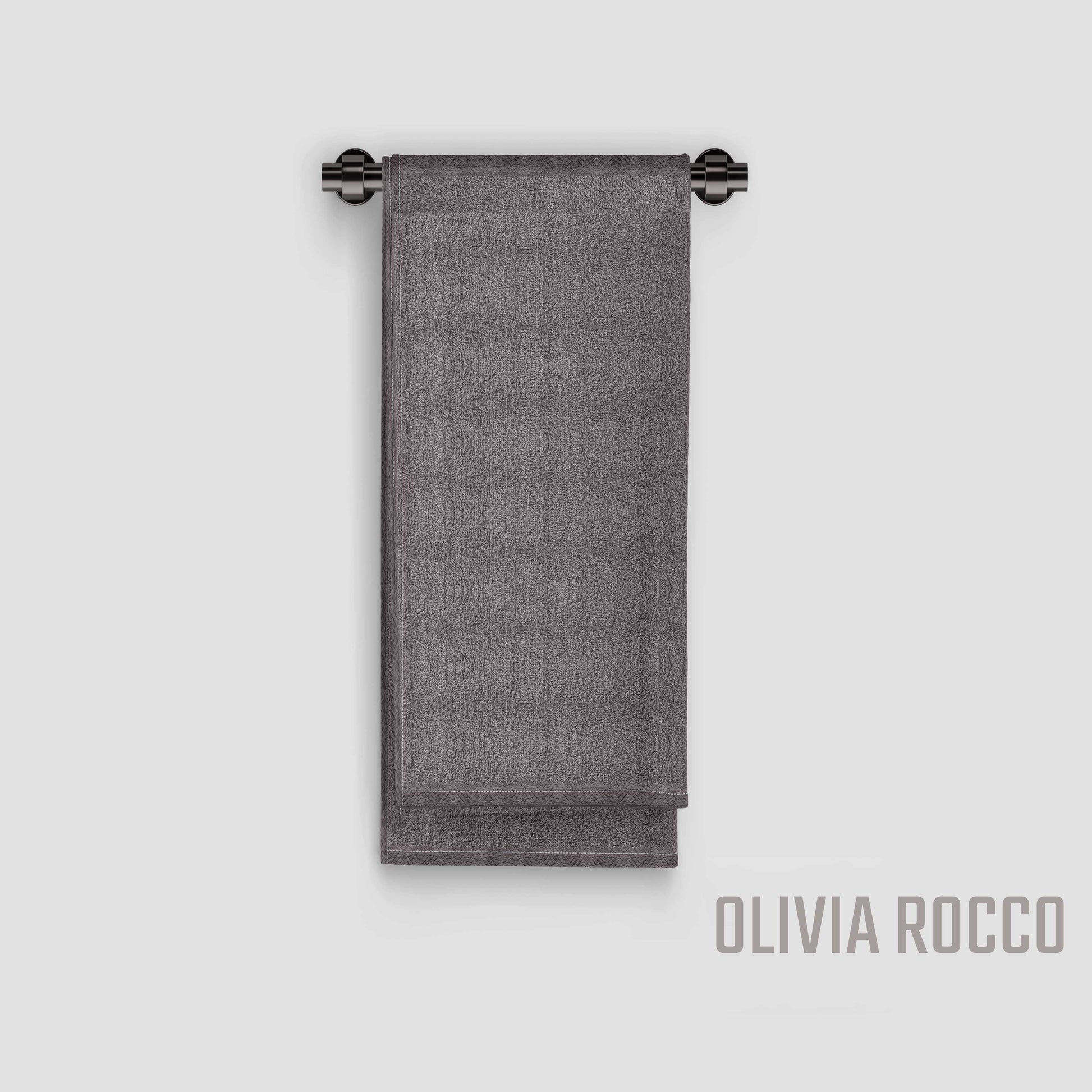 Lifestyle image of OLIVIA ROCCO's elegant cotton bath sheets in modern bathroom setting, enhancing the decor while showcasing their generous size and colourfast design.
