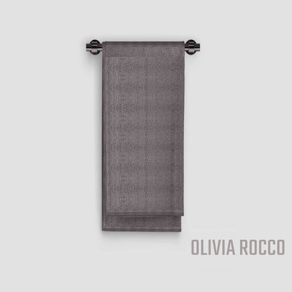 Lifestyle image of OLIVIA ROCCO's elegant cotton bath sheets in modern bathroom setting, enhancing the decor while showcasing their generous size and colourfast design.