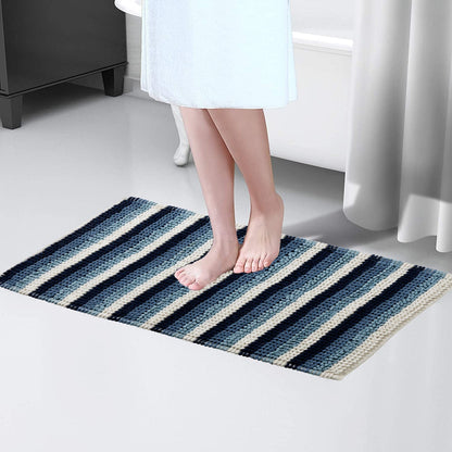 Superior comfort Padstow Stripe Bathmat displayed in a stylish bathroom setting, illustrating its plush soft texture and classic stripe design, tailored for a luxurious experience.