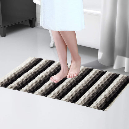 Stylish Padstow Stripe Bathmat displayed in a modern bathroom setting, illustrating its quick-drying features and anti-slip design for safety.