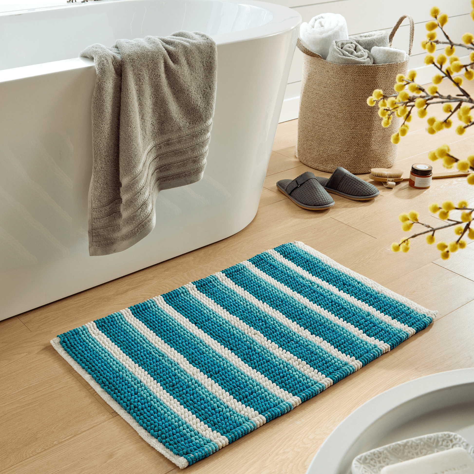 Luxurious Padstow Stripe Bathmat in soft stripes, 50x80 cm, showcasing superior comfort and high absorbency for an elegant bathroom experience.