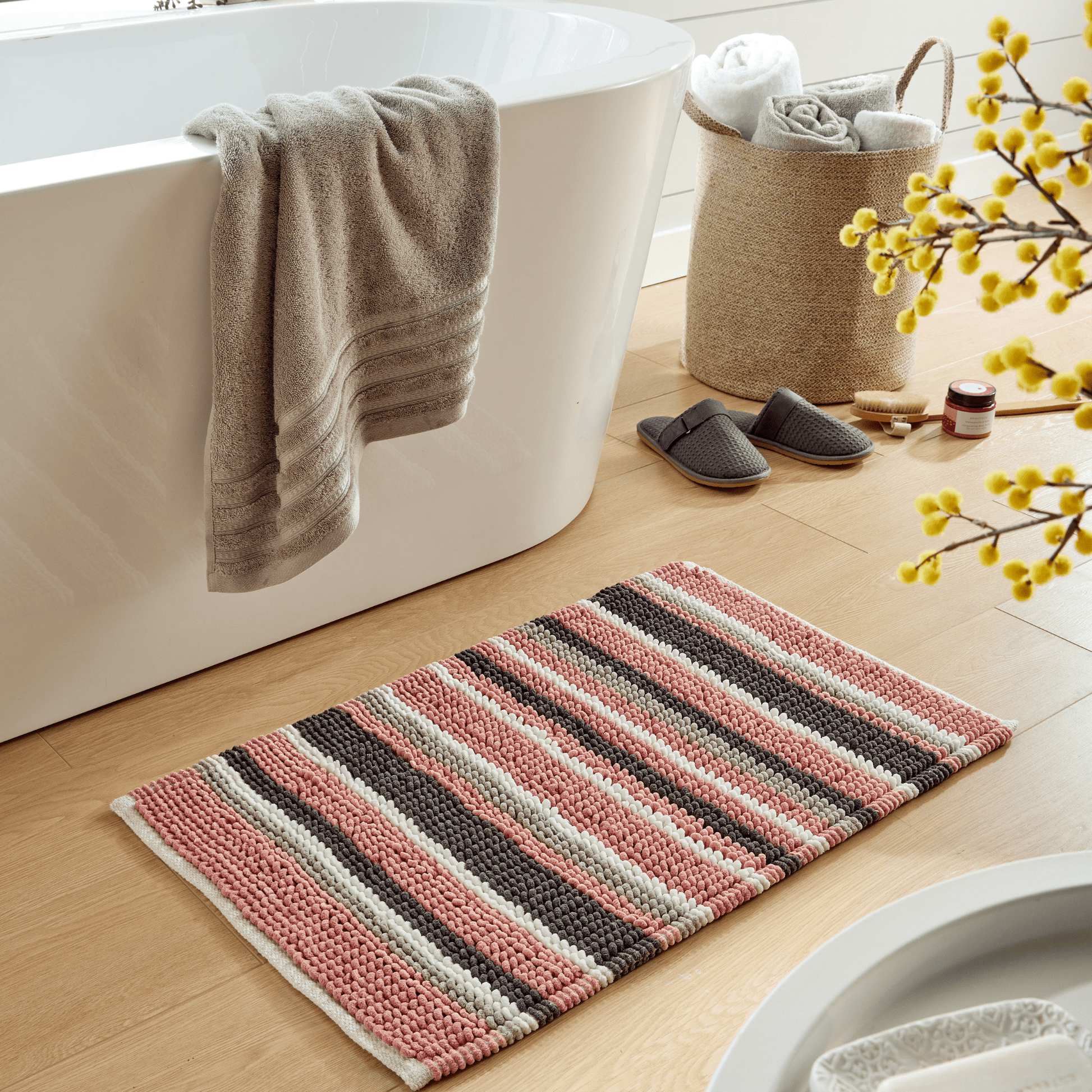 Close-up of the sumptuous fabric of the Padstow Stripe Bathmat, illustrating its perfect blend of softness and resilience for a comfortable bathroom experience.