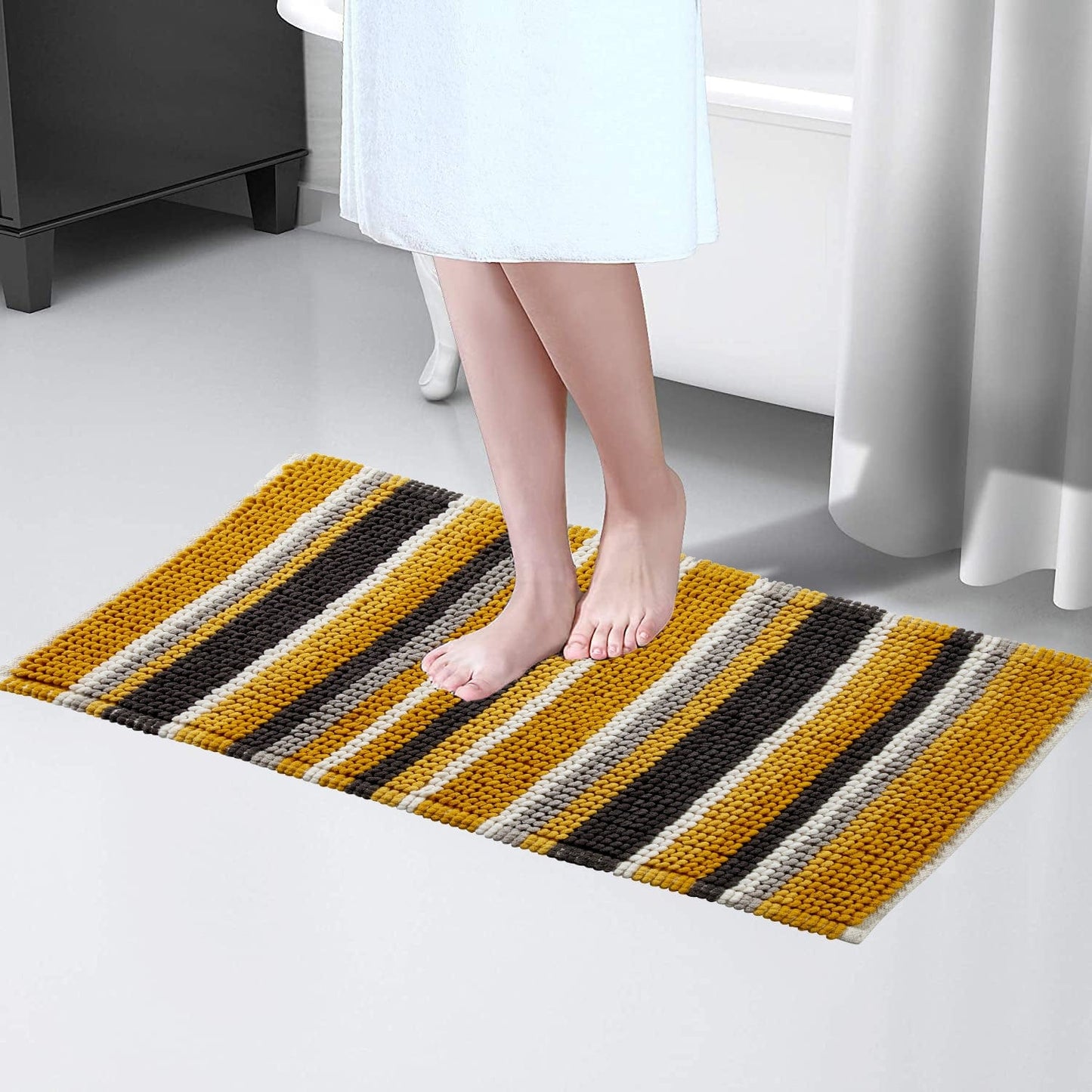 Elegant Padstow Stripe Bathmat in a fashionable colour scheme, perfectly complementing contemporary bathroom décor while providing a comfortable and dry surface.