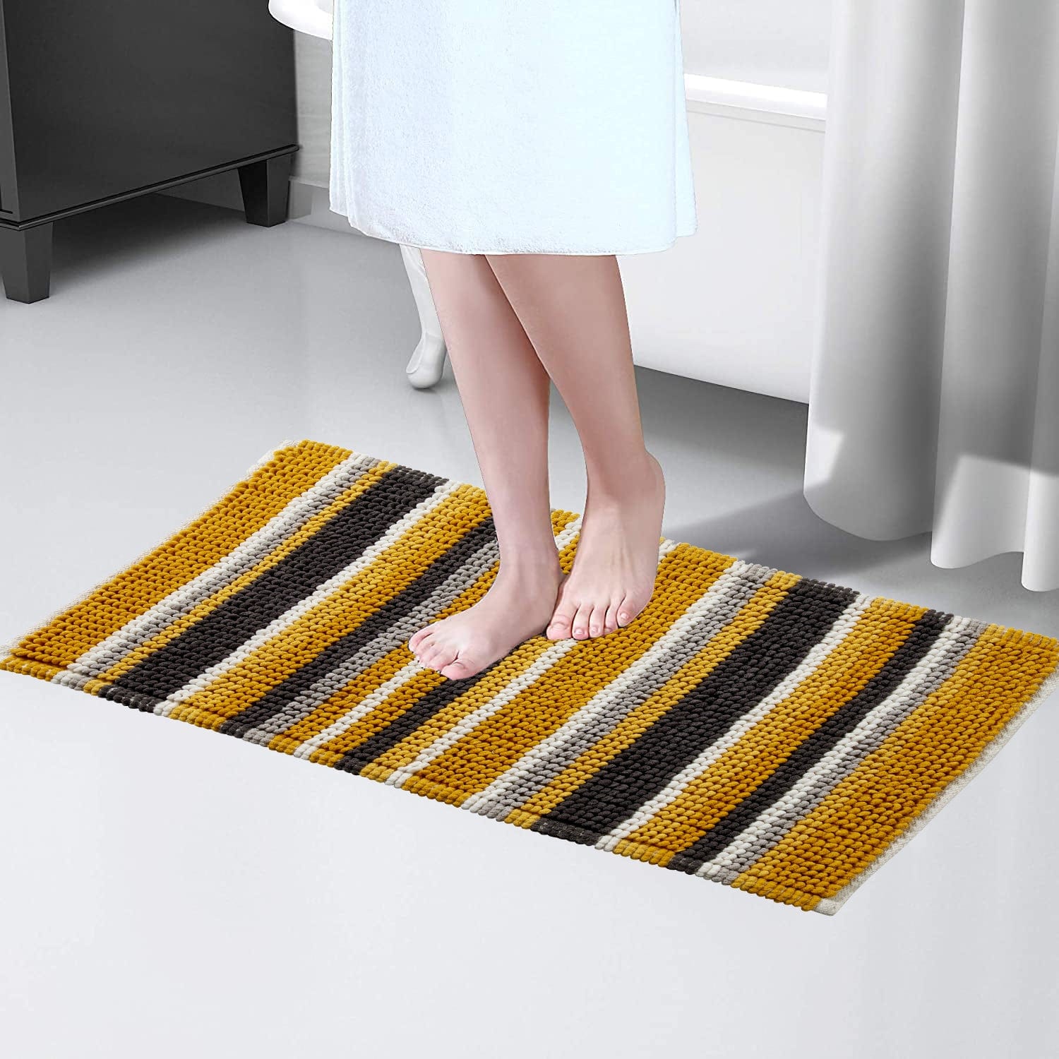 Elegant Padstow Stripe Bathmat in a fashionable colour scheme, perfectly complementing contemporary bathroom décor while providing a comfortable and dry surface.