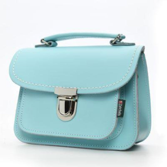 Close-up view of the elegant push-lock clasp on the Luna Baby Blue Leather Handbag, highlighting quality craftsmanship.