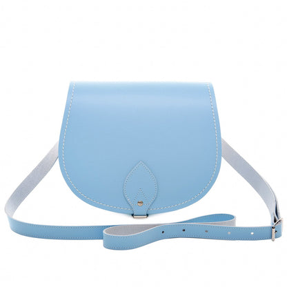 Exquisite Handmade Leather Saddle Bag in Pastel Baby Blue, showcasing superior craftsmanship, adjustable strap, and personalised engraving option.