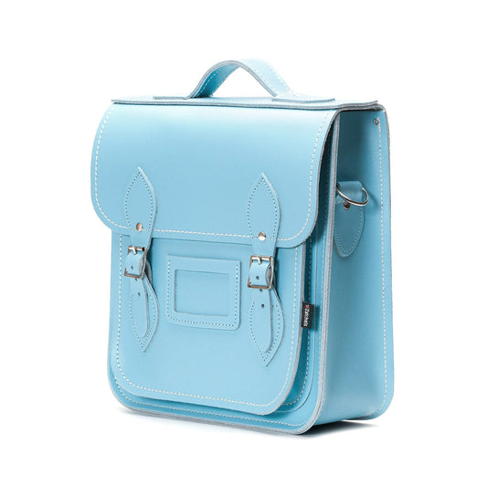 Chic design features of the Pastel Baby Blue Leather City Backpack, including matching stitching and stylish silver nickel buckles.