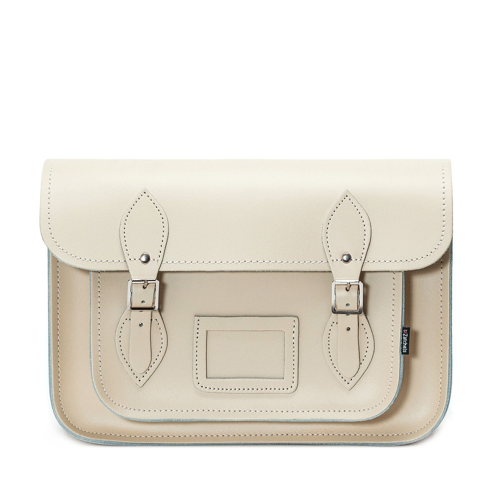 Handcrafted pastel cream leather satchel with adjustable cross-body strap, showcasing luxurious craftsmanship and elegant design.