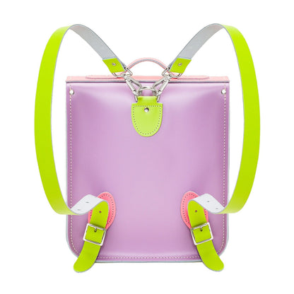 Pastel Kaleidoscope Handmade Leather City Backpack set against a city backdrop, emphasising its fashionable flair and suitability for urban adventures with tablet and laptop storage.