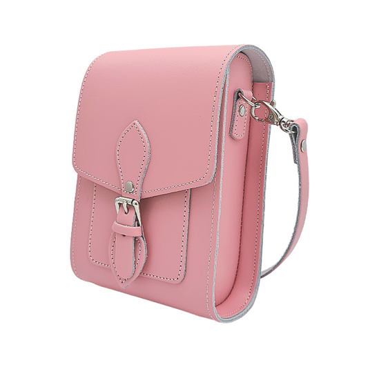 Elegant pastel pink handmade leather festival phone bag with adjustable strap, showcasing premium craftsmanship, ideal for stylish outings, featuring slip-in card pockets and magnetic closure.