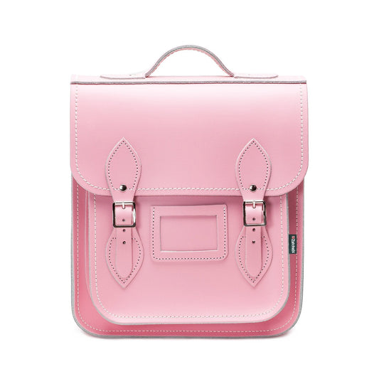Handmade Leather City Backpack in pastel pink, showcasing exquisite British craftsmanship and elegant design, featuring silver nickel buckles and adjustable straps, perfect for city explorers.