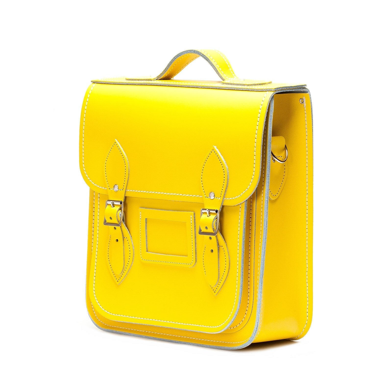 Versatile Premium Leather City Backpack featuring silver nickel buckles, perfect for accommodating tablets and laptops in a chic pastel yellow.