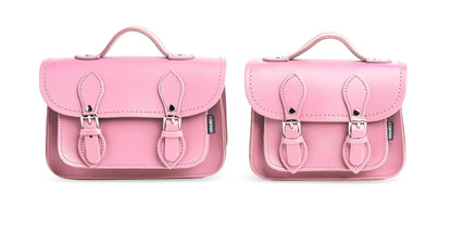 Close-up of the nickel silver buckles and matching stitching detail on the pastel pink leather micro satchel, highlighting quality craftsmanship.