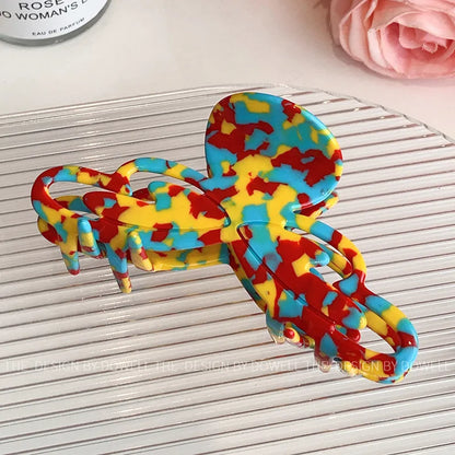 Elegant Dove Acetate Large Shark Clip in a luxury lifestyle context, representing vintage-inspired hair accessories for women.