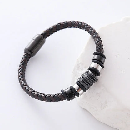 Elegant men's bracelet made of leather with a sophisticated double ring design and durable 304 stainless steel, ideal for daily wear or special occasions.
