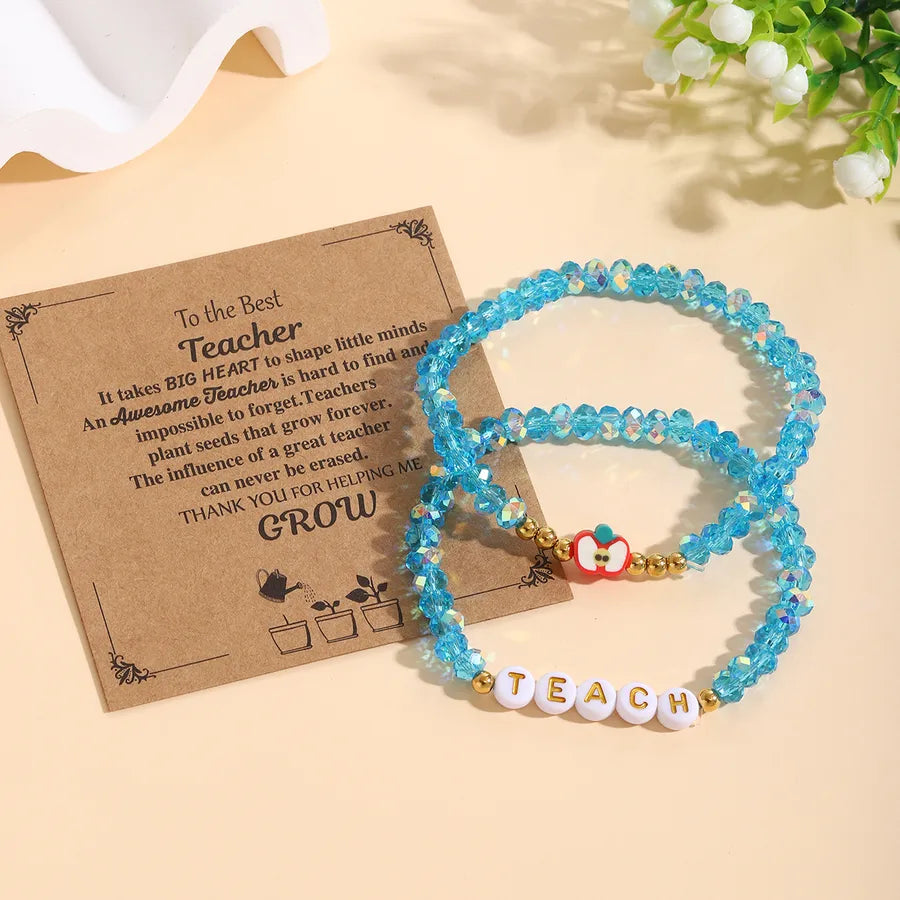 Close-up of the beautiful apple pattern beaded bracelet, crafted with acrylic and glass for a luxurious touch.