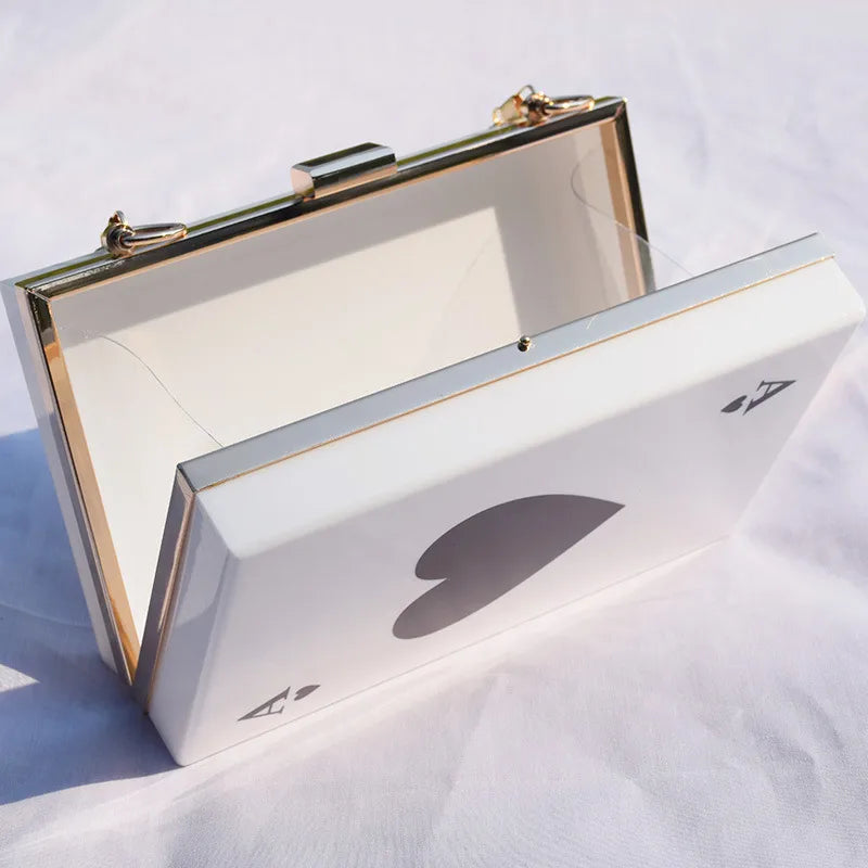 Versatile black cherry acrylic women's messenger bag with a luxurious chain strap, embodying contemporary elegance and style for modern women.