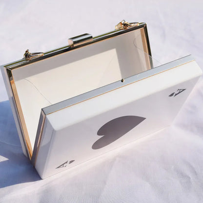 Versatile black cherry acrylic women's messenger bag with a luxurious chain strap, embodying contemporary elegance and style for modern women.