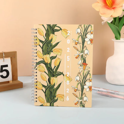 Elegant A5 spiral notebook adorned with a floral and giraffe motif, the perfect planner for luxury-loving students.