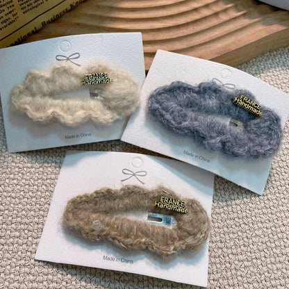 Stylish luxurious lamb fur hair clip featuring a chic water drop design, ideal for women's premium accessories.