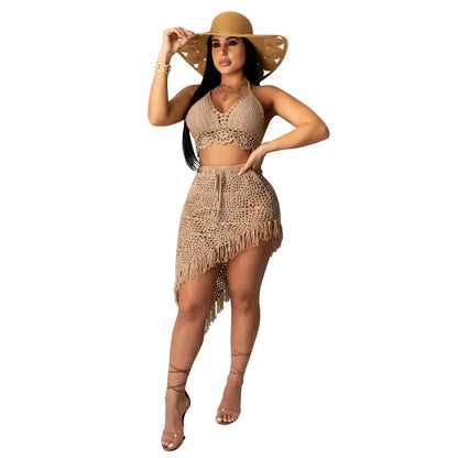 Fashion-forward women's summer outfit featuring a solid colour skirt co-ord set with tassel embellishments, ideal for a stylish getaway.