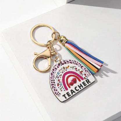Stylish unisex wooden keychain adorned with a colourful rainbow tassel, ideal for school and graduation celebrations.