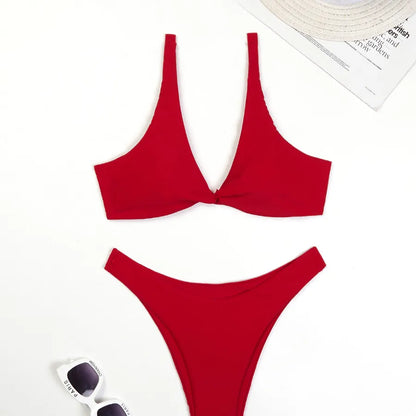 Elegant solid colour women's bikini set showcasing a stylish low waist and flattering triangle cups, ideal for luxurious summer days by the water.