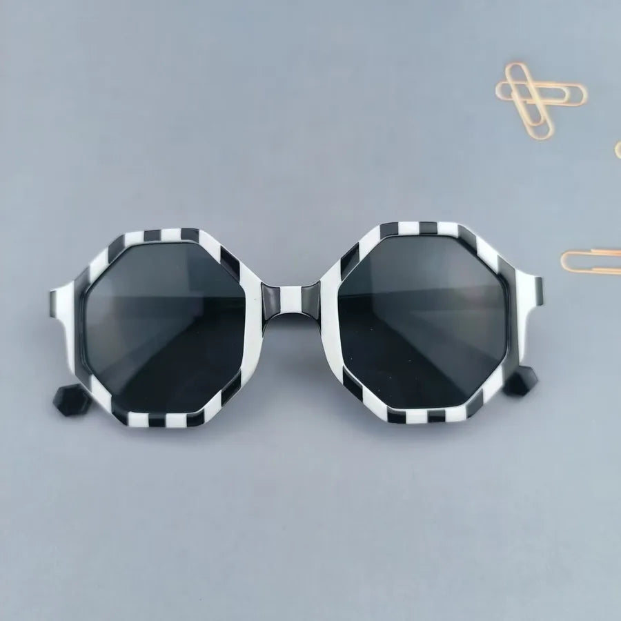 Adorable modern design sunglasses for kids, showcasing a geometric style suitable for outdoor adventures.