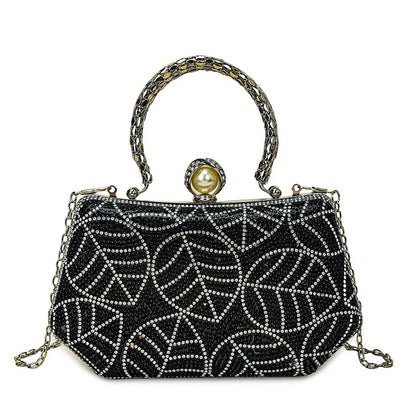 Close-up of diamond embellishments on a luxurious square evening bag, highlighting exquisite craftsmanship and style.