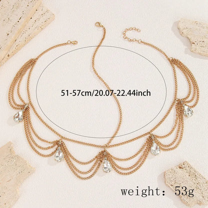 Luxurious chic gold wave chain headband featuring elegant waterdrop tassels, perfect for a sophisticated plaid hair accessory.