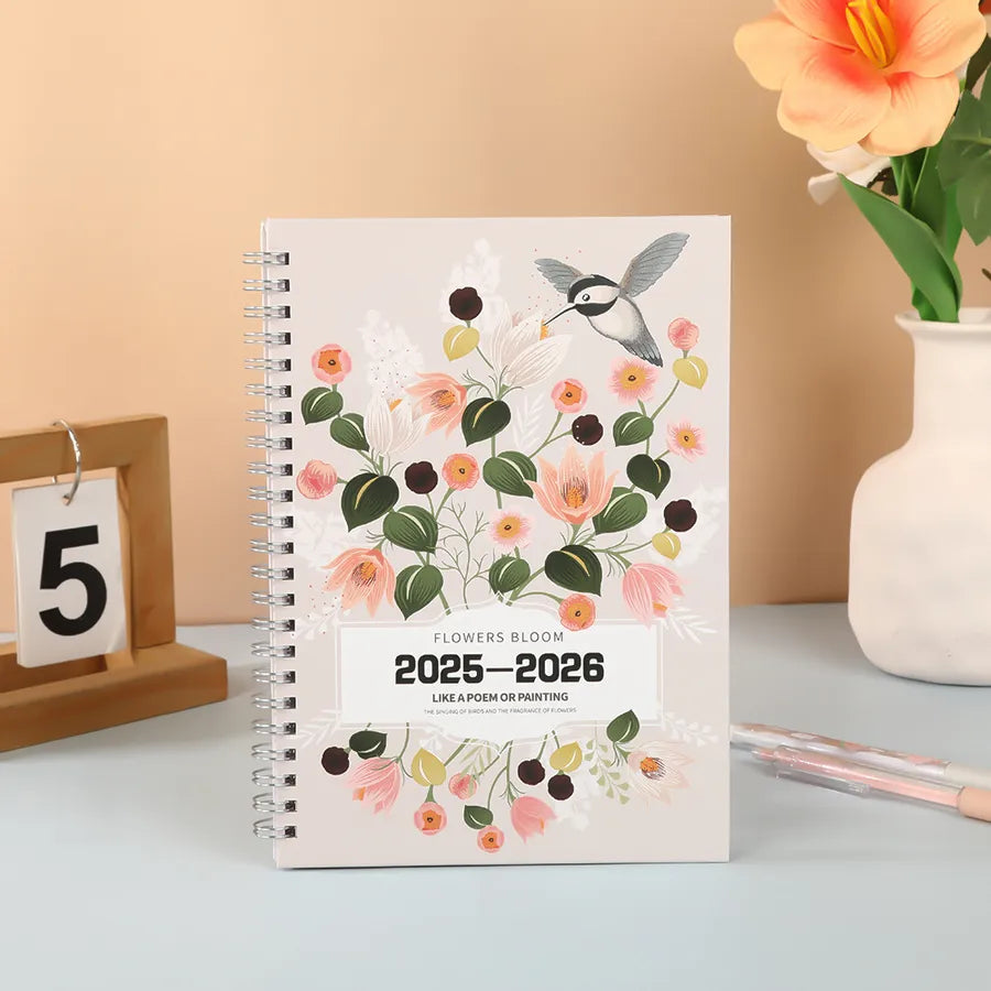 Stylish A5 floral and giraffe patterned spiral notebook, crafted for the discerning student in the 2026 academic year.