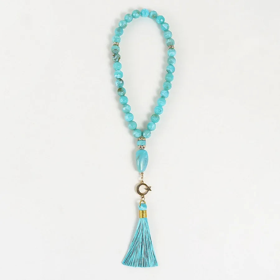 Opulent unisex tassel rosary in classical ethnic style, highlighting a harmonious blend of pink, blue, and black colours.