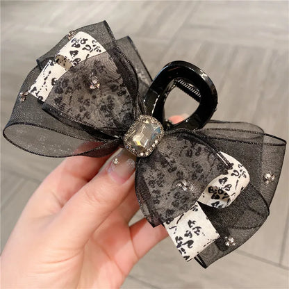 Showcasing the versatility of the elegant floral silk shark clip in various hairdos, perfect for women seeking luxurious headwear options.