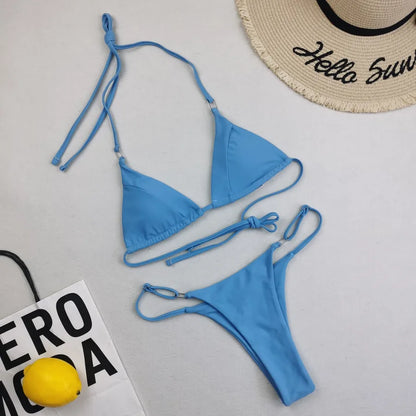 Luxury women's solid colour bikini set featuring a sleek triangle cup design, perfect for sophisticated poolside lounging.