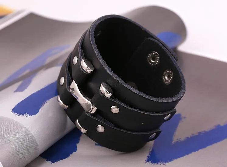 Stylish close-up of unisex black leather punk bracelet, showcasing its unique geometric pattern and luxurious finish, ideal for business or formal occasions.